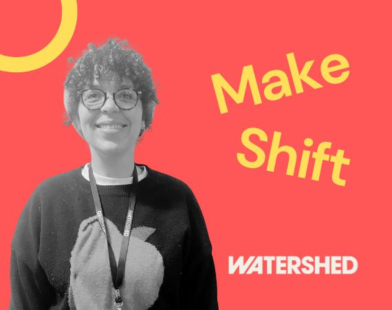Black and white image of a smiling person with curly hair and glasses, set against a red background with the words "Make Shift" and "Watershed" in yellow and white.