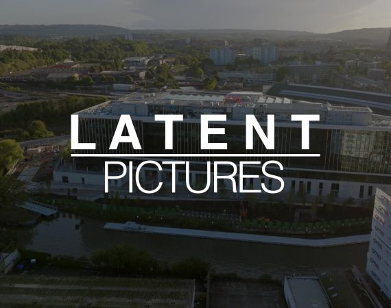 An image of a cityscape, with the LATENT PICTURES text overlaid on it. 