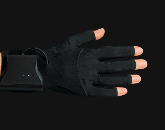 a horizontal hand wearing a MIMU black glove, with a black background. 
