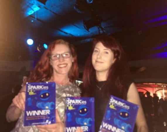 Verity McIntosh (accepting a Sparkie on behalf of Clare Reddington) with Sammy Payne of Open Bionics