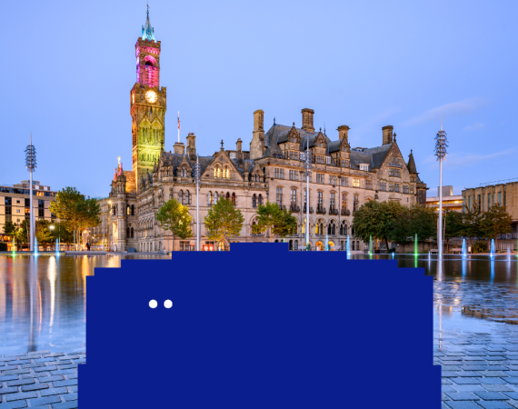 Big blue character is peering over to the left, Bradford city hall is in the background.
