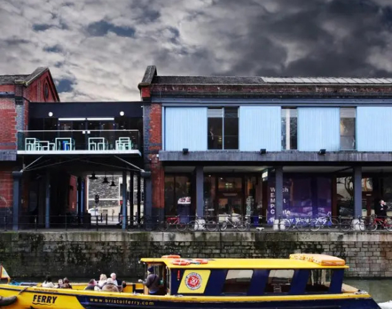 Watershed exterior shot under an overcast and storm sky