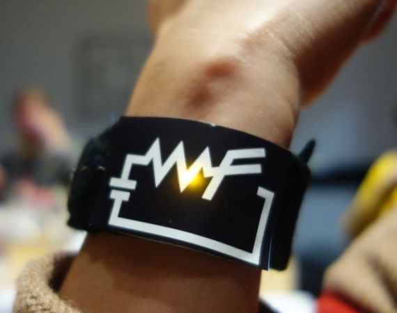 Picture of a women wearing a "WF" bracelet