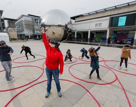 People playing dancing shadows in Millennium Square