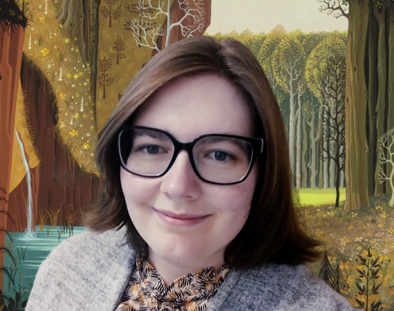 A picture of a smiling woman with shoulder-length brown hair and black glasses. The background is a still image of a forest from the animated Disney Film Sleeping Beauty.