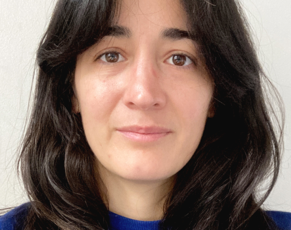 a headshot of Domenica looking into the camera.