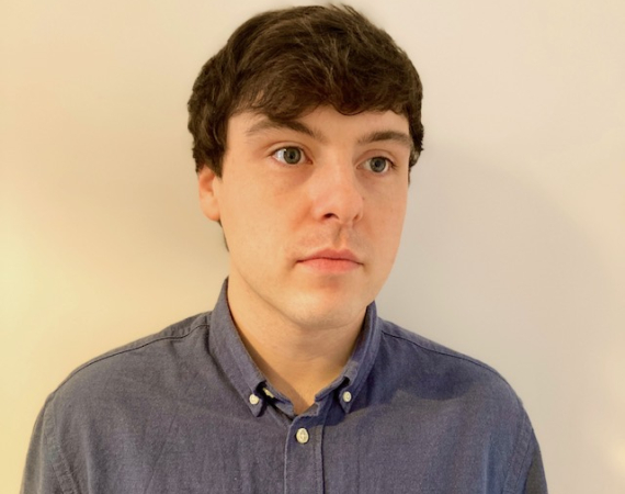 A head and shot of Gary-Martin on a light background. 