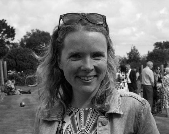 Black and white image of woman smiling at camera