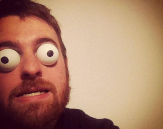 A photo of a man with googly eyes