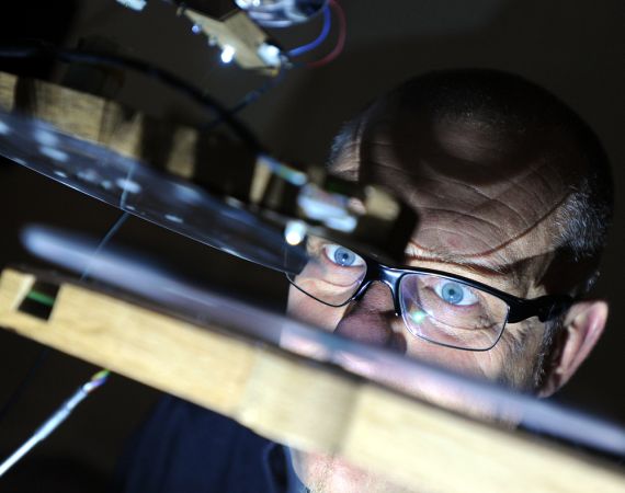 Steve Symons looking at a light synthesiser