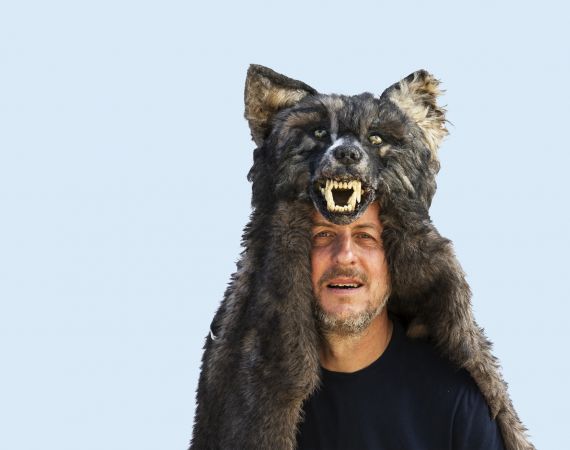 Simon Evans wearing a wolf headress