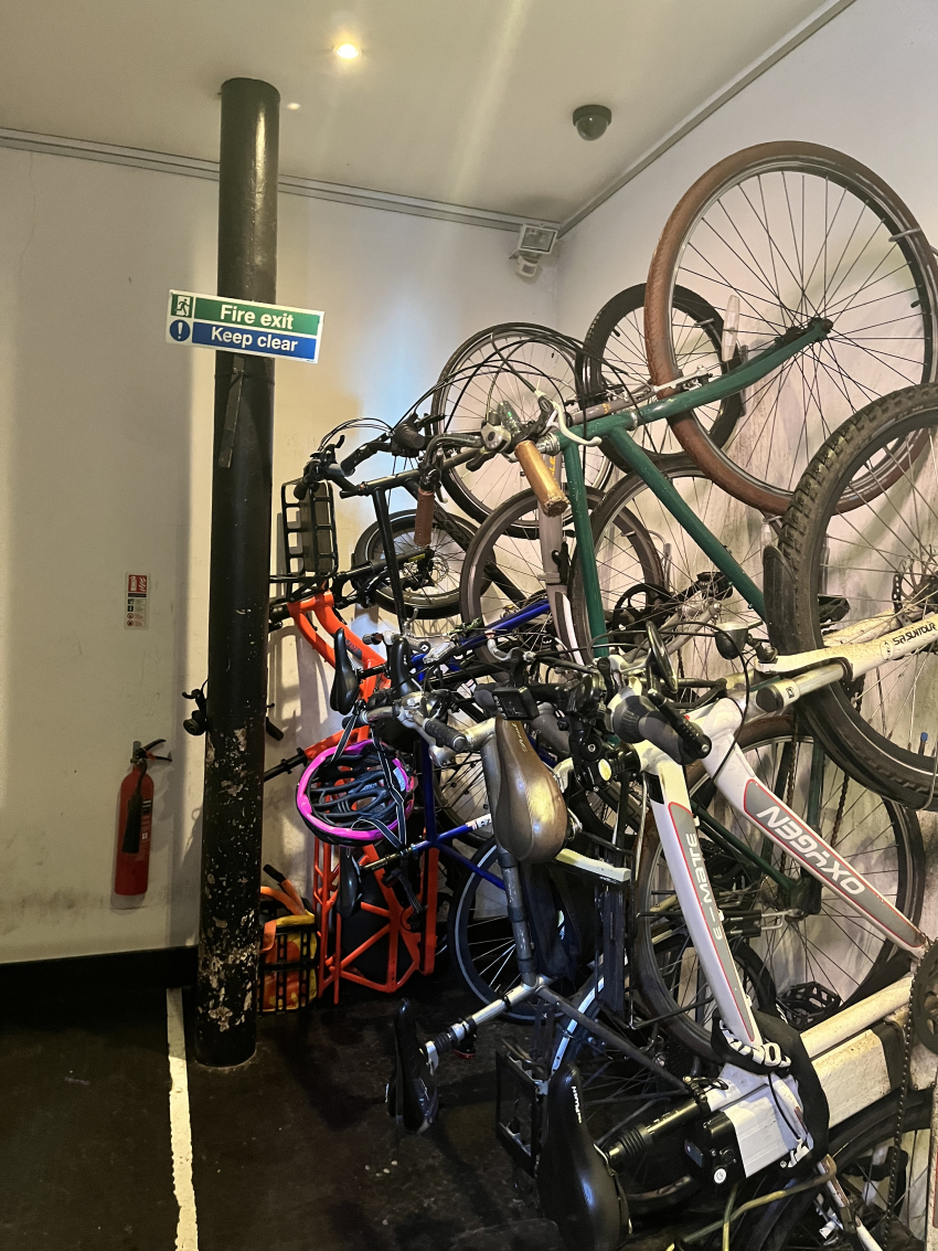 a room pack full of bicycle stored on their back legs. My orange long tail bike is squeezed into the far corner. 